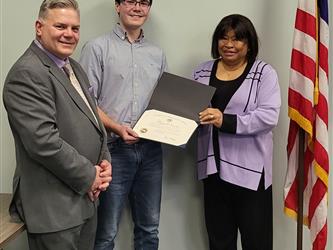 Superintendent-Director Ernest F. Houle with a student awardee 