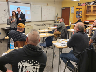 PAC members watch a senior project presentation