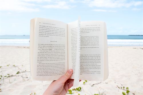 an open book at the beach