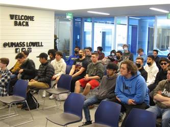 Students in chairs watching a presentation