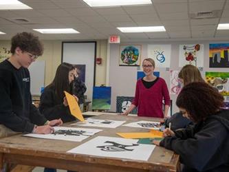 Students in the art classroom working on projects 