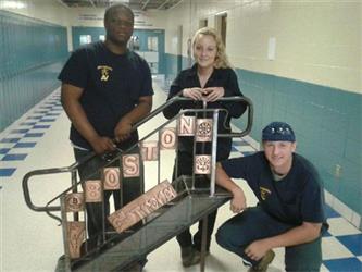 Students with their metal sculpture 