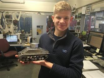 student with metal sculpture